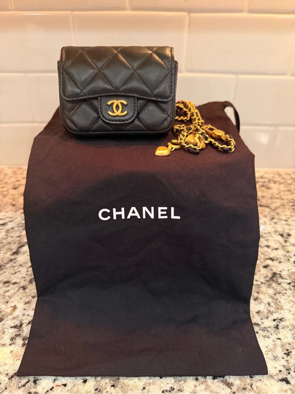 CHANEL Black Quilted Mini Flap with Gold Chain and CC